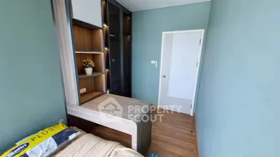 Modern compact bedroom with built-in storage and sleek design