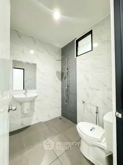 Modern bathroom with sleek shower and elegant tile design