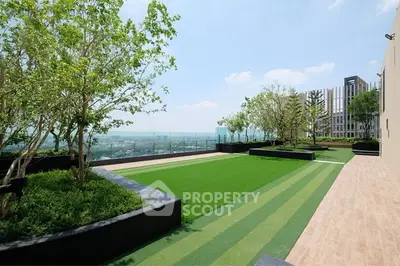 Stunning rooftop garden with panoramic city views and lush greenery.