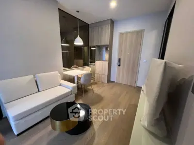 Modern living room with stylish furniture and elegant lighting in a contemporary apartment.