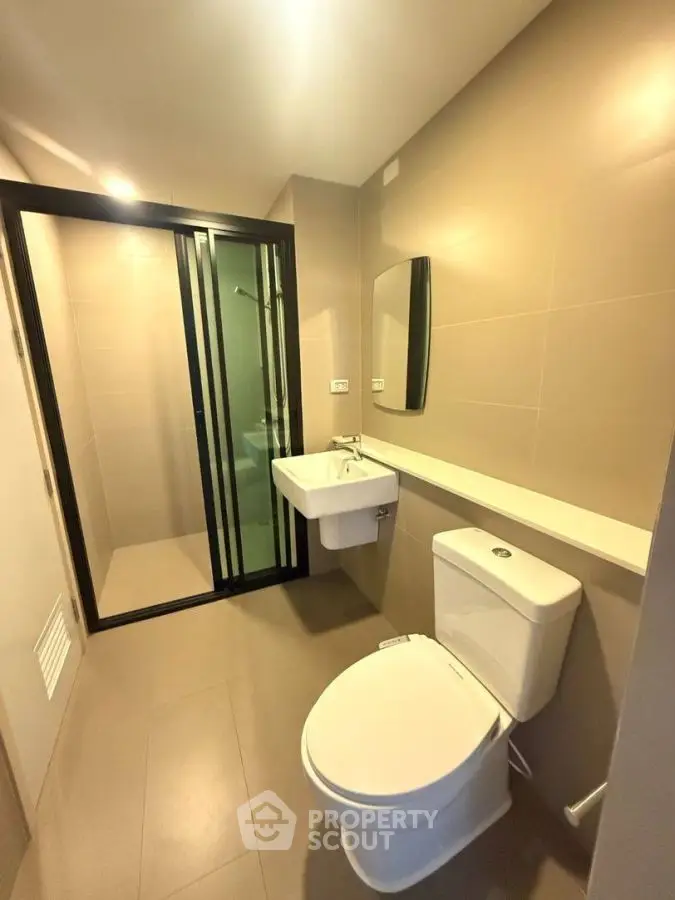 Modern bathroom with sleek design and glass shower enclosure