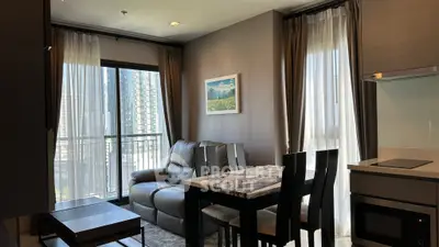 Modern living room with city view, stylish furniture, and natural light.