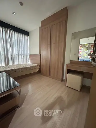 Cozy bedroom with wooden furniture and natural light