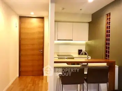 Modern kitchen with sleek design and breakfast bar seating