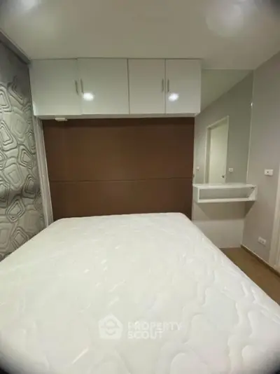 Modern bedroom with built-in storage and stylish decor
