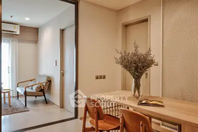 Modern apartment interior with stylish dining area and cozy living room, featuring elegant wooden furniture and natural light.