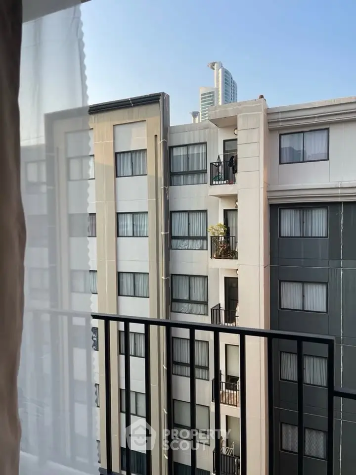 Urban apartment view from balcony with modern high-rise buildings