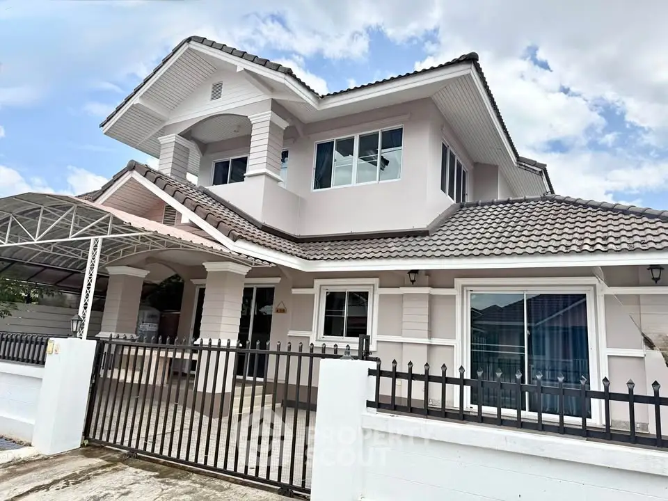 Stunning two-story house with modern architecture and spacious driveway in a serene neighborhood.