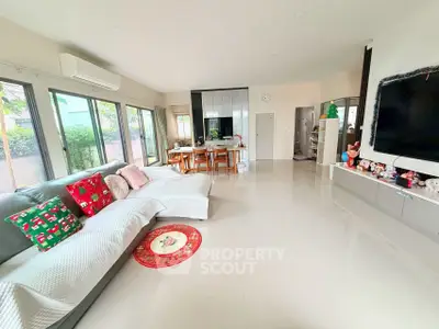 Spacious modern living room with large windows and stylish decor