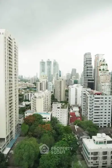 Stunning cityscape view of modern high-rise buildings and lush greenery, perfect for urban living enthusiasts.