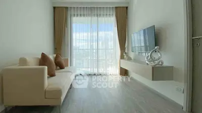 Modern living room with large window and stylish decor