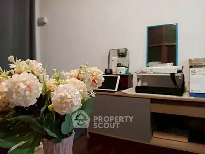 Cozy home office with floral decor and modern desk setup