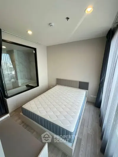 Modern bedroom with large window and stylish decor