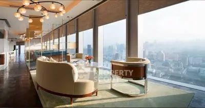 Luxurious high-rise living room with panoramic city views and elegant modern furniture.