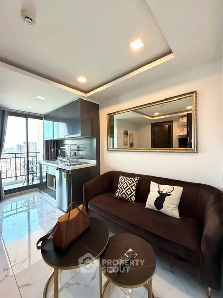 Modern living room with stylish decor and balcony view in a high-rise apartment.
