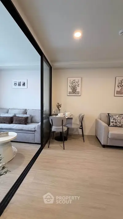 Modern living room with stylish decor and cozy seating area in a contemporary apartment.