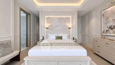 Luxurious bedroom with elegant decor and soft lighting, featuring a plush bed and stylish furnishings.