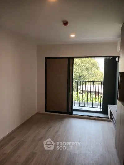 Spacious modern living room with balcony and natural light