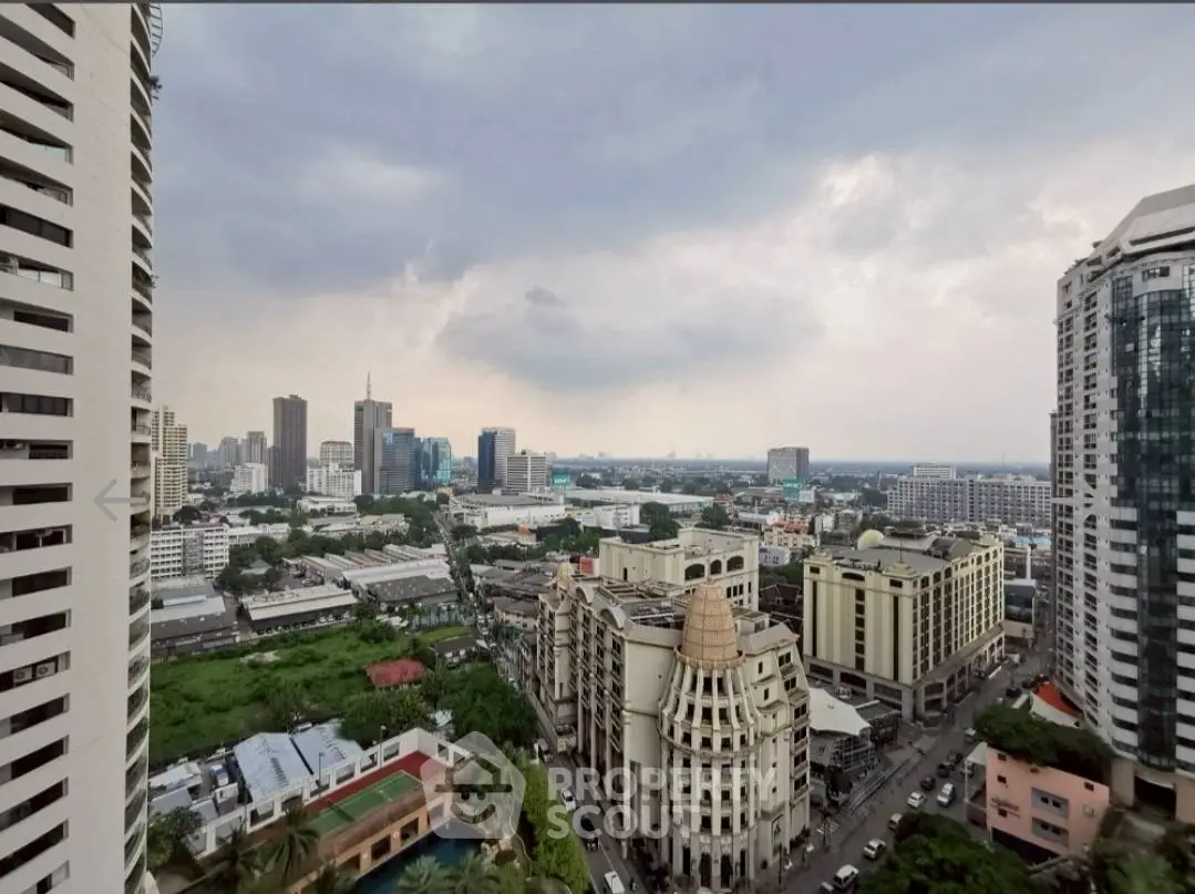 Stunning cityscape view from high-rise building showcasing urban skyline and architectural diversity.