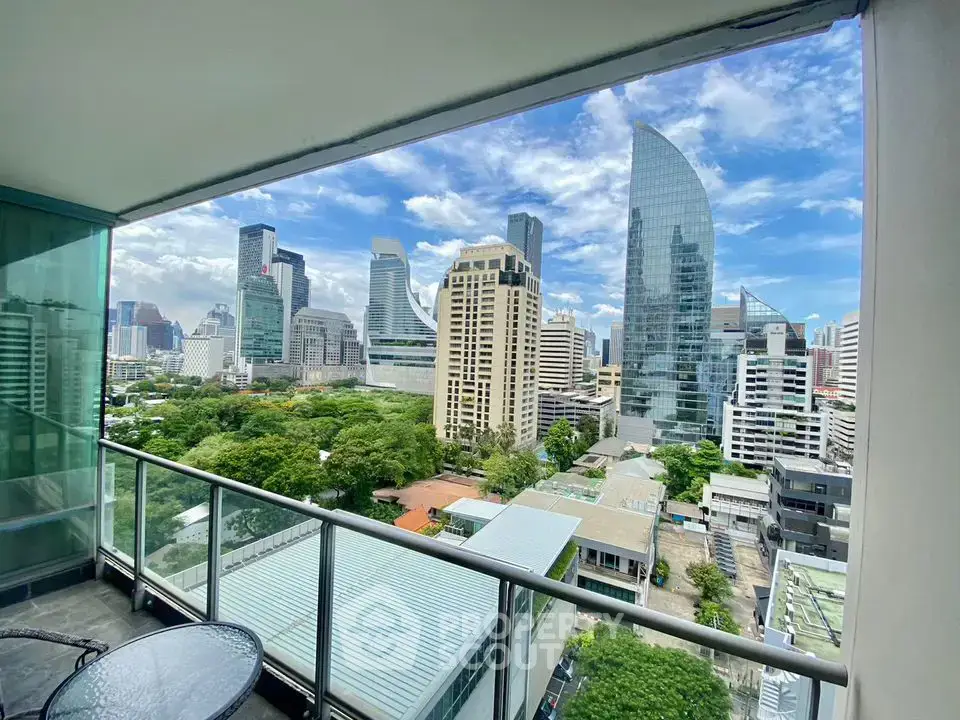 Stunning cityscape view from a modern balcony in a high-rise apartment.