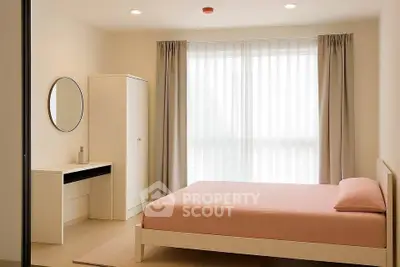 Modern minimalist bedroom with natural light and stylish furnishings.