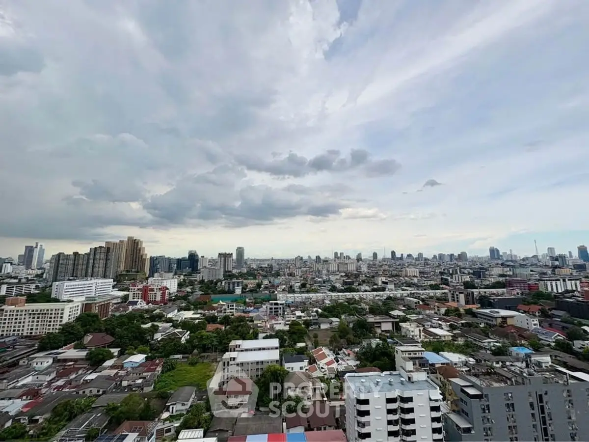 Stunning panoramic cityscape view from high-rise building showcasing urban skyline.