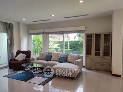 Spacious living room with modern furniture and garden view