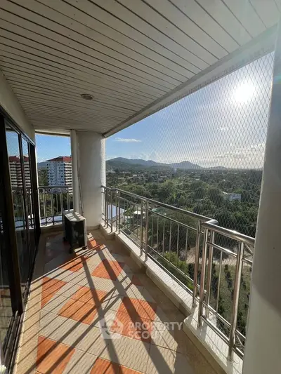 Spacious balcony with stunning mountain and city views, perfect for relaxation and enjoying the outdoors.