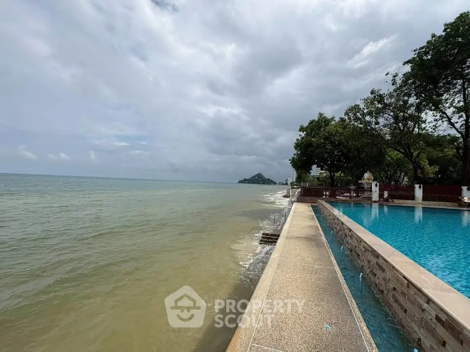 Stunning beachfront property with infinity pool and ocean view, perfect for luxury living.