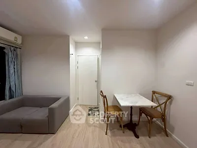 Cozy living room with modern furniture and dining area
