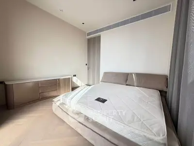 Modern bedroom with sleek furniture and natural light