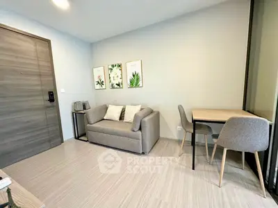 Modern living room with stylish sofa and dining area in a cozy apartment.