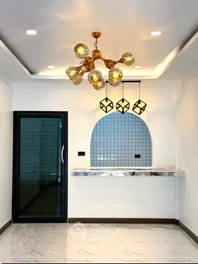Modern interior with stylish lighting and sleek marble flooring, perfect for contemporary living.