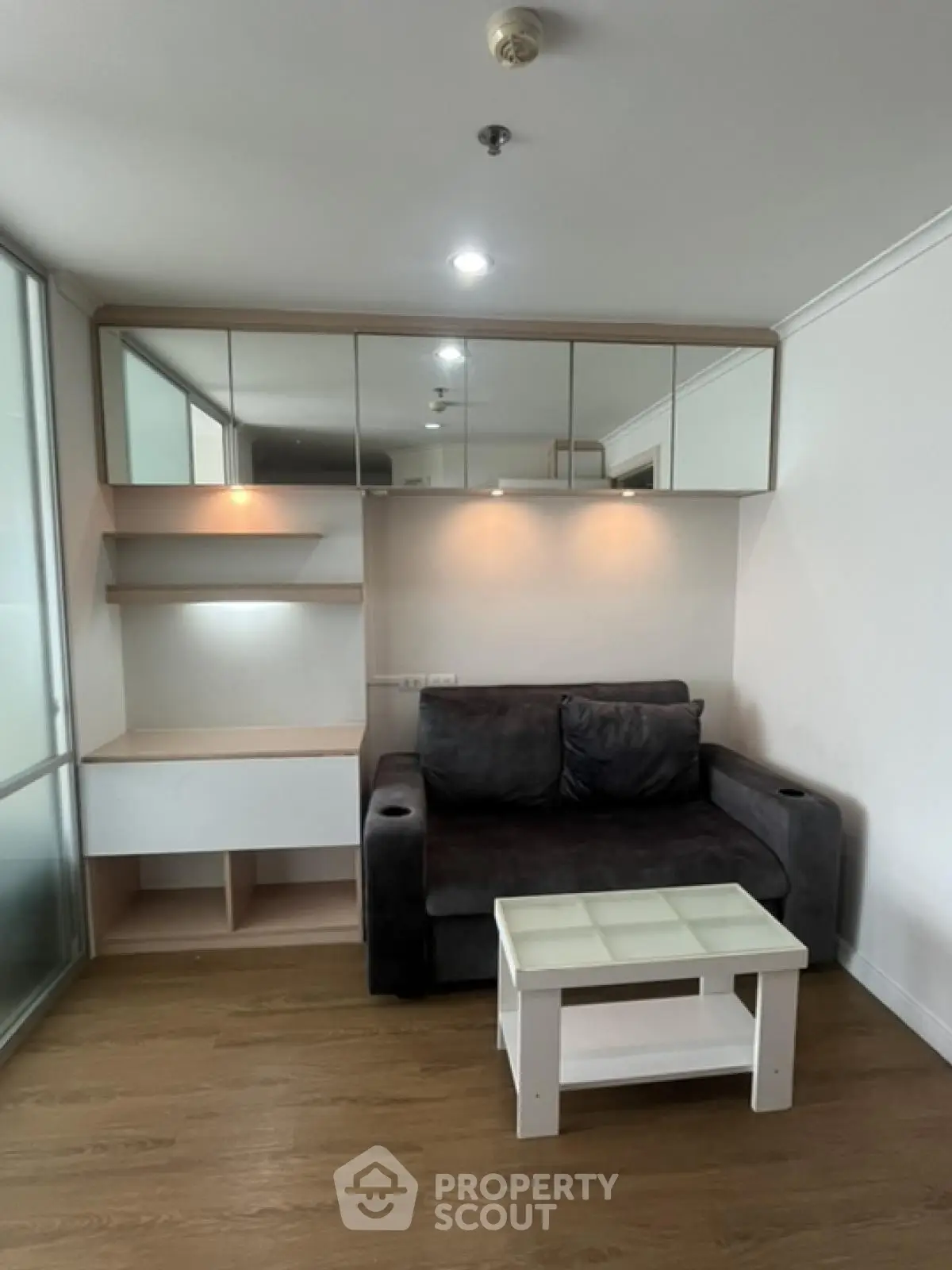 Cozy living room with modern sofa and stylish shelving unit