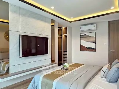 Luxurious modern bedroom with stylish decor and built-in TV, featuring elegant lighting and a cozy atmosphere.