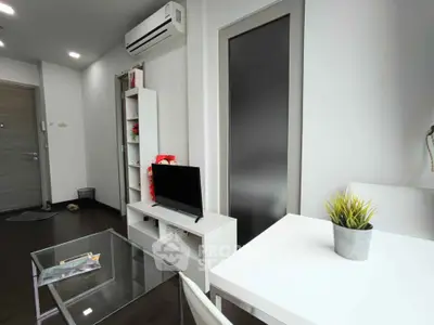 Modern living room with sleek furniture and air conditioning