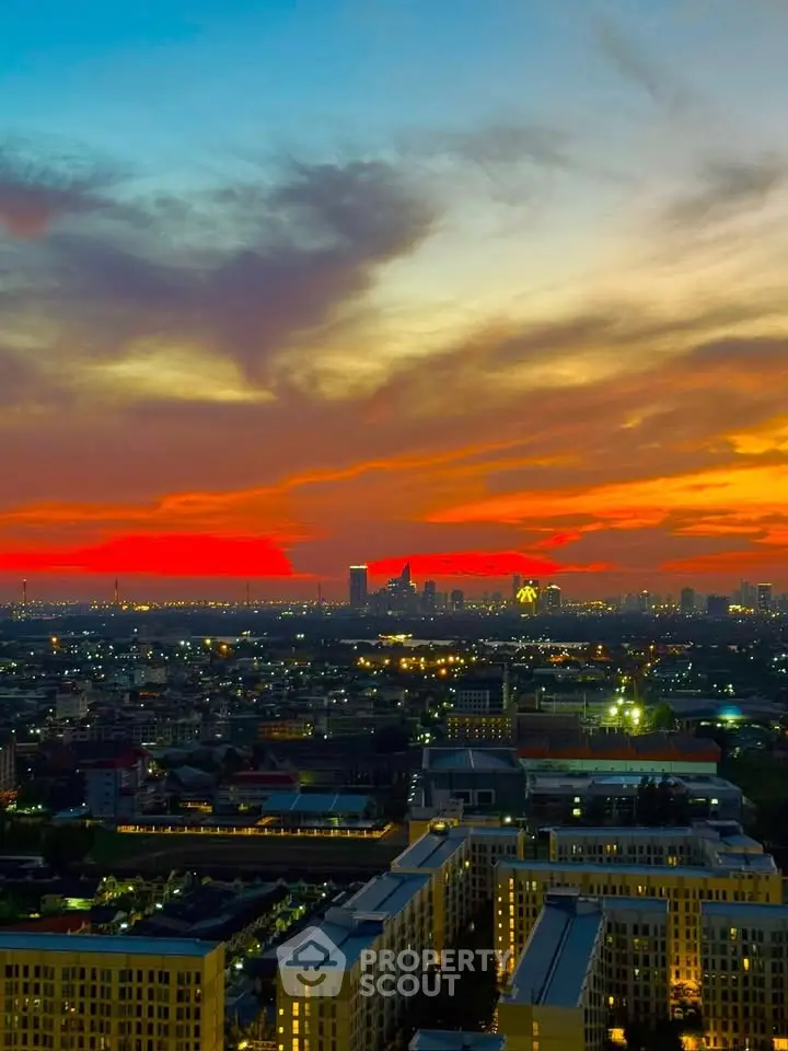 Stunning cityscape view at sunset with vibrant sky over urban skyline.