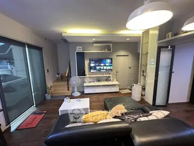 Modern living room with stylish decor and entertainment center
