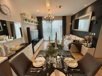 Luxurious modern living room with elegant decor and large windows offering natural light.