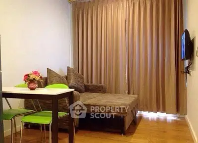 Cozy living room with modern decor and comfortable seating in a stylish apartment.