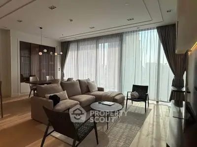 Luxurious modern living room with floor-to-ceiling windows and elegant decor