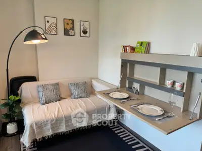 Cozy living room with modern decor and foldable dining table, perfect for small spaces.