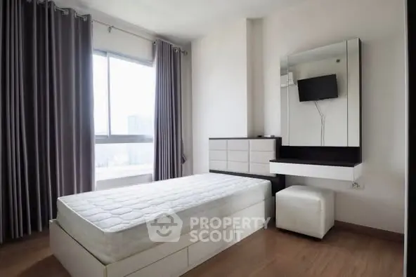Modern minimalist bedroom with large window and sleek furniture