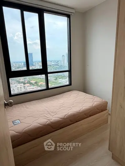 Cozy bedroom with stunning city view and natural light