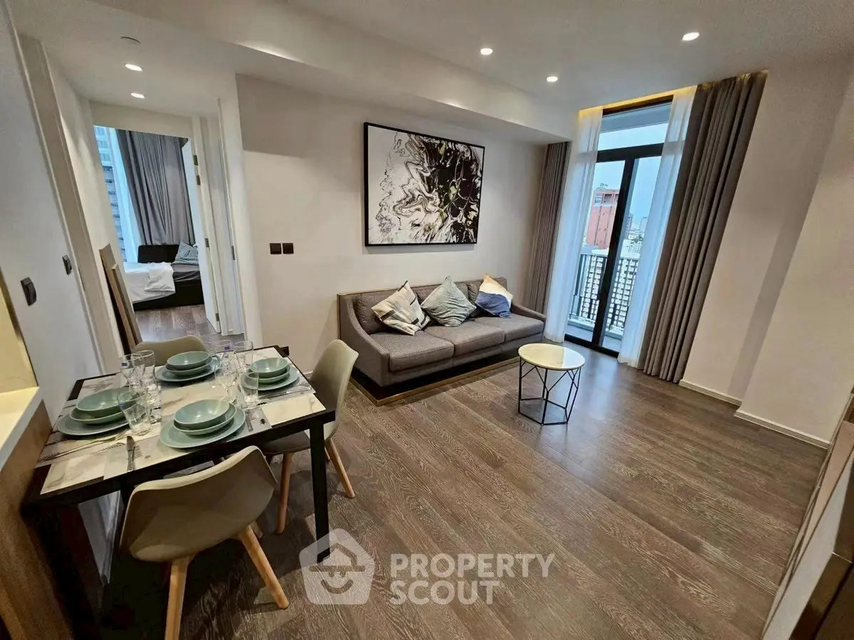 Modern living room with stylish decor and city view balcony