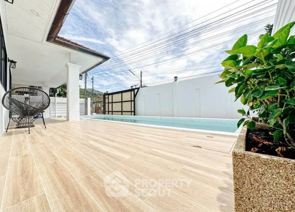 Luxurious modern home with private pool and spacious patio, perfect for relaxation and entertainment.