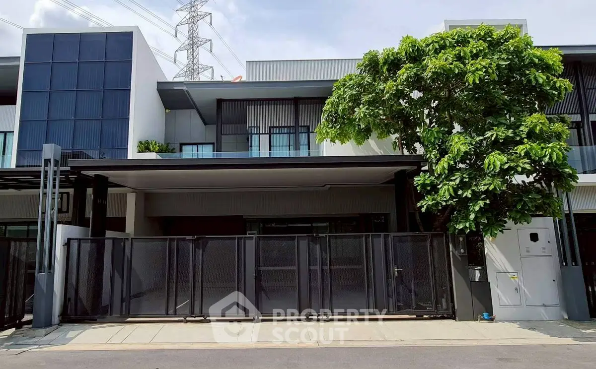 Modern two-story house with sleek design and spacious driveway