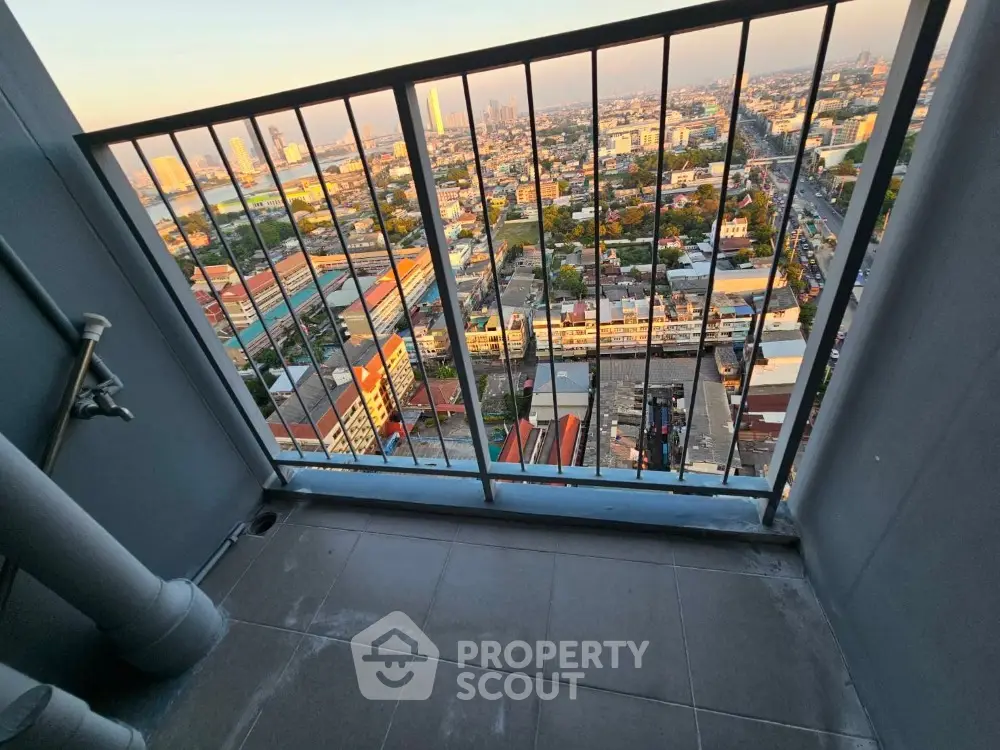 Breathtaking high-rise balcony view overlooking vibrant cityscape, perfect for urban living enthusiasts seeking a serene retreat amidst the bustling city life.