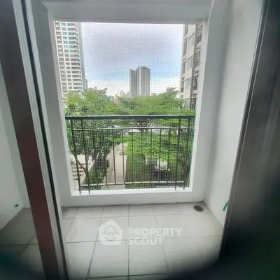 Charming balcony with city view, perfect for relaxation and enjoying the urban landscape.