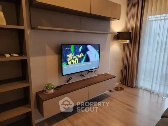 Modern living room with wall-mounted TV and stylish decor